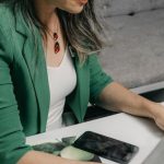 Typing Laptop - Woman Sitting at a Desk and Typing on a Laptop