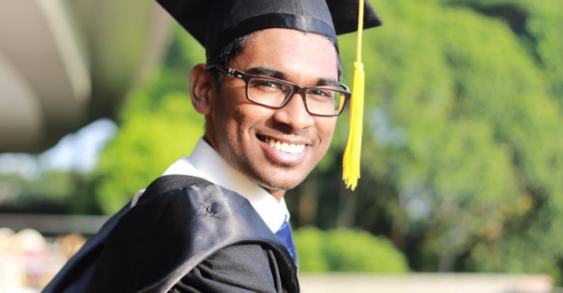 Graduation Cap - Man Wearing Black Graduation Gown and Cap