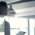 CEO Office - Formal man with tablet giving presentation in office