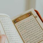 Gavel Book - A man holding an open quran book