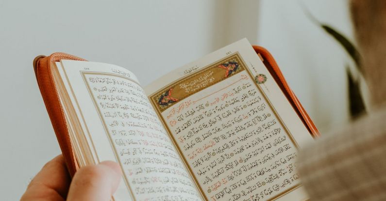 Gavel Book - A man holding an open quran book