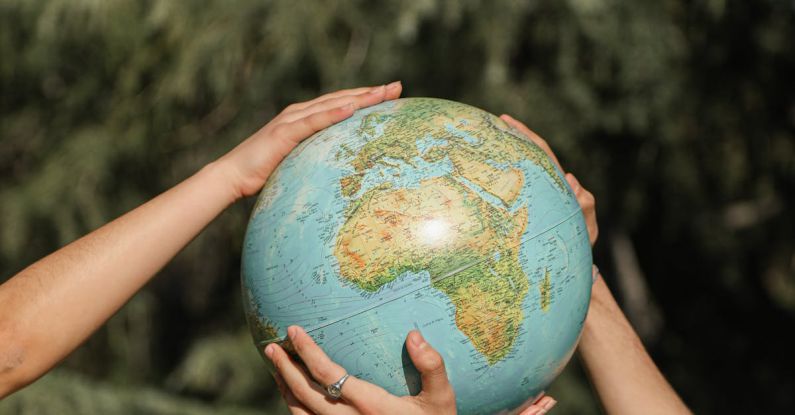 Globe Hands - People Holding a Globe