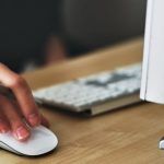 Job Search - Person Holding Apple Magic Mouse