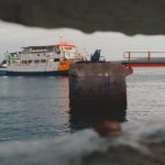 Employment Gap - A ferry boat is seen through a hole in the wall