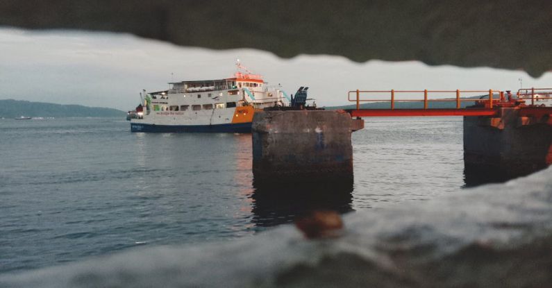 Employment Gap - A ferry boat is seen through a hole in the wall