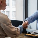 Resume Tips - Ethnic businessman shaking hand of applicant in office