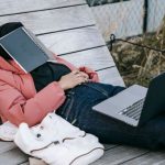 Dream Job - Unrecognizable woman with laptop resting on bench in park