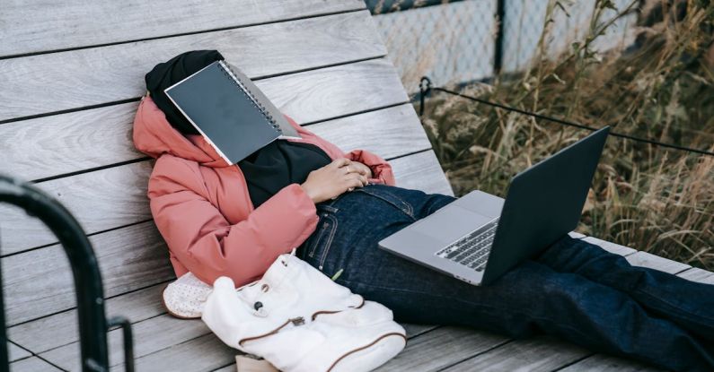 Dream Job - Unrecognizable woman with laptop resting on bench in park