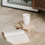 Internship Search - Laptop and books on floor carpet