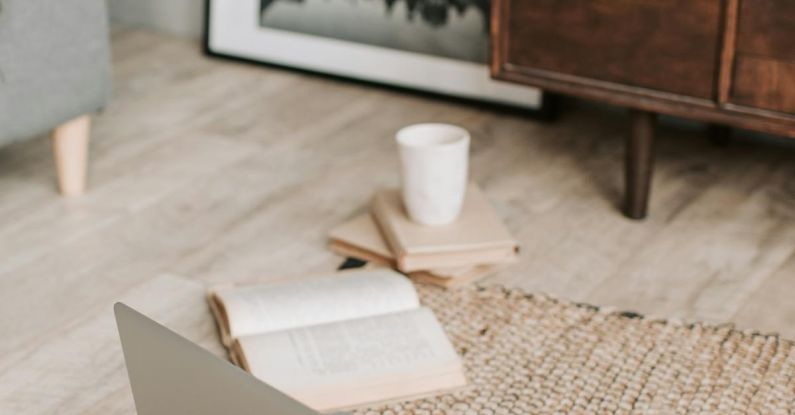 Internship Search - Laptop and books on floor carpet