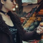 Internship Choice - A woman standing in front of a fruit stand