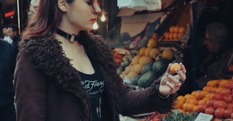 Internship Choice - A woman standing in front of a fruit stand