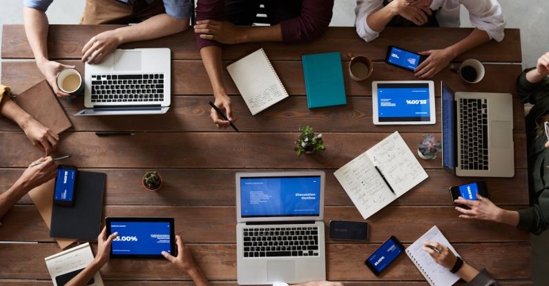 Internship Conversion - Top View Photo Of People Near Wooden Table