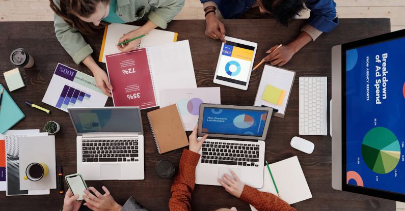 Career Planning - A Group of People Discussing Charts