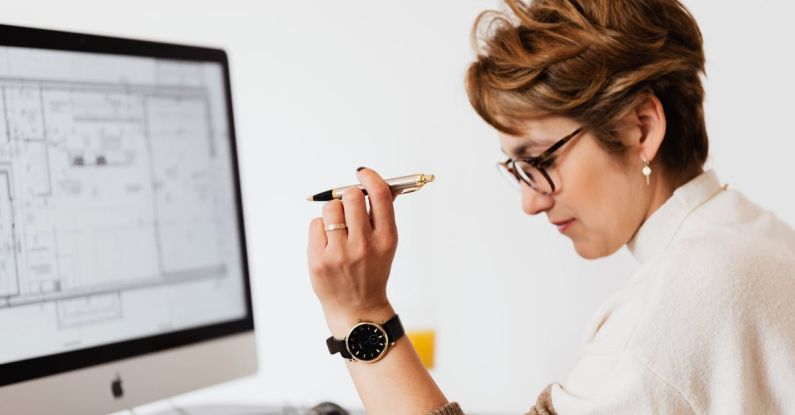 Career Decision - Concentrated adult female thinking about business project in office