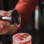 Interview Preparation - A bartender pouring a drink into a glass