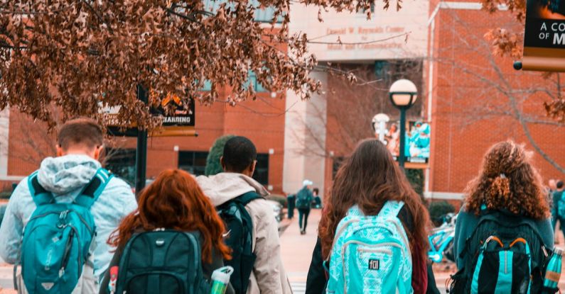 College Campus - People Wearing Backpacks