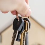 Employment Agency - Person with keys for real estate